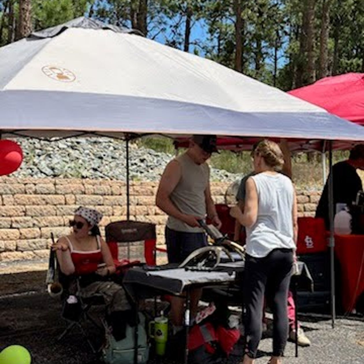 vendor booth set up under an umbrella